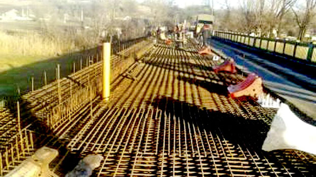В Краснолиманском районе продолжили ремонт моста и дороги