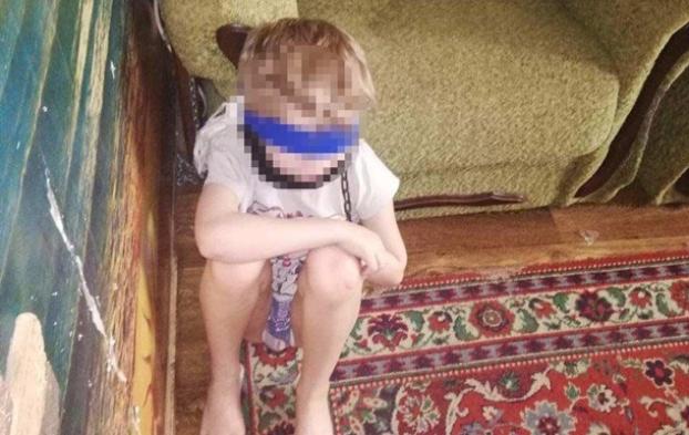 Опекун в Днепре посадила восьмилетнего ребенка на цепь